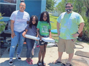 newss letter may 2020, group leaders deliver packages to students